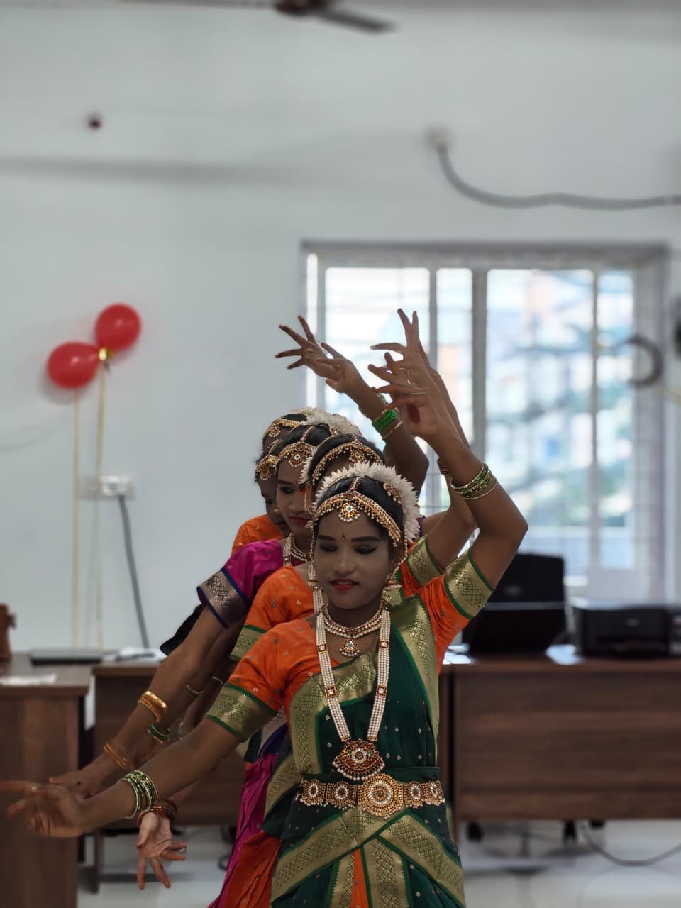 Close-up of a student performing a classical dance at the Rise Against Hunger India Hyderabad office inauguration