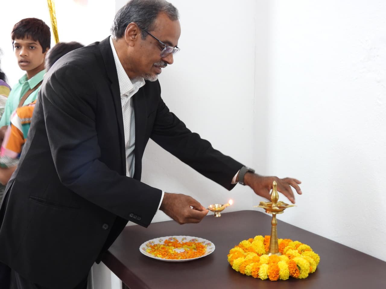Traditional lamp-lighting ceremony at the inauguration of Rise Against Hunger India's new Hyderabad office