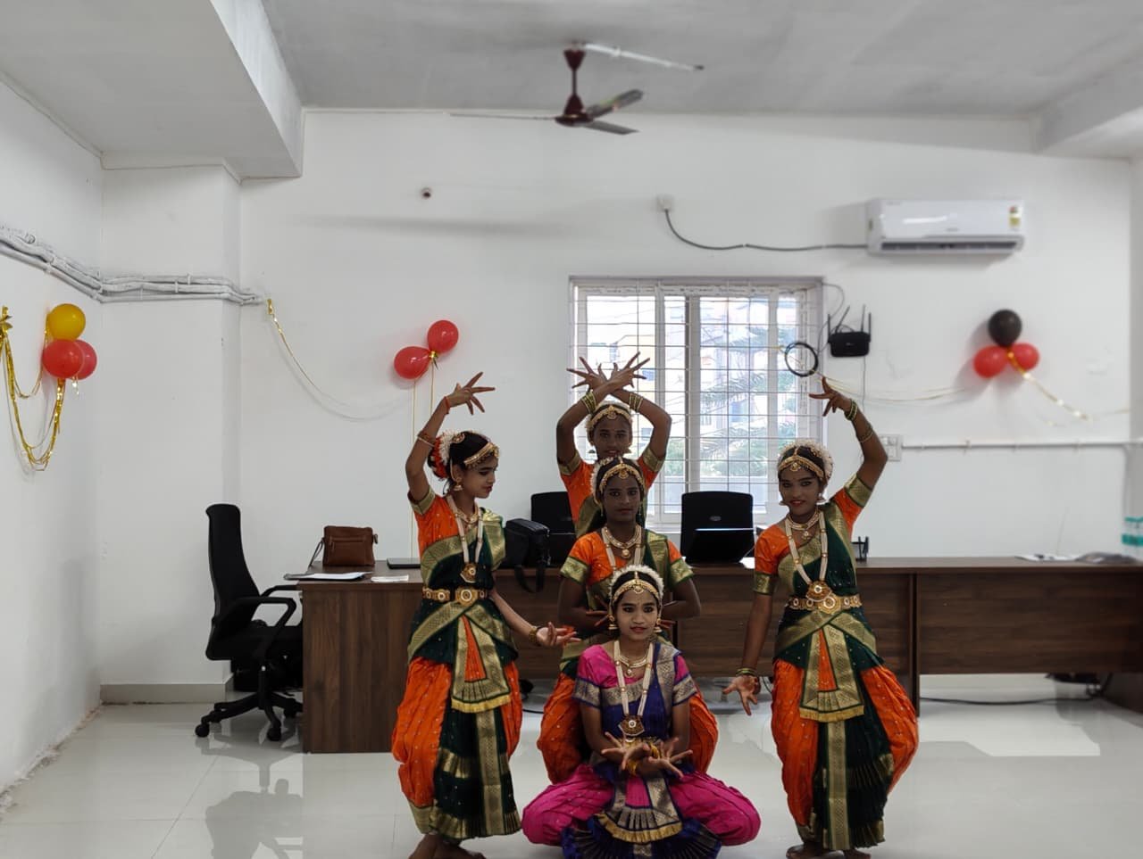 Students from partner organizations perform a vibrant Bharatanatyam dance at the Hyderabad office inauguration
