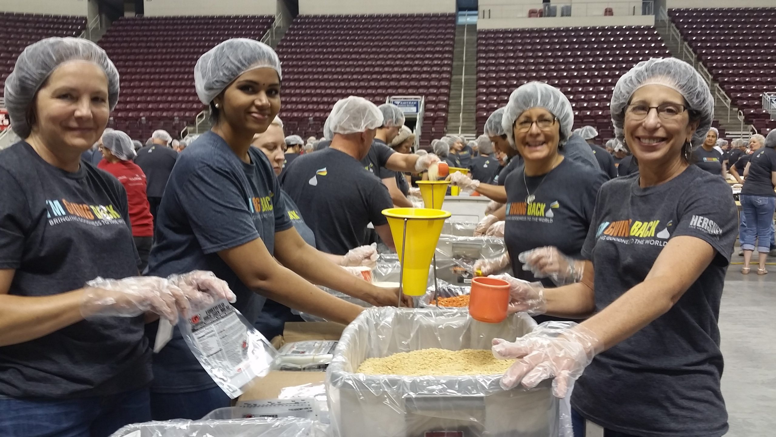 Volunteers packaging meals at a Rise Against Hunger India event