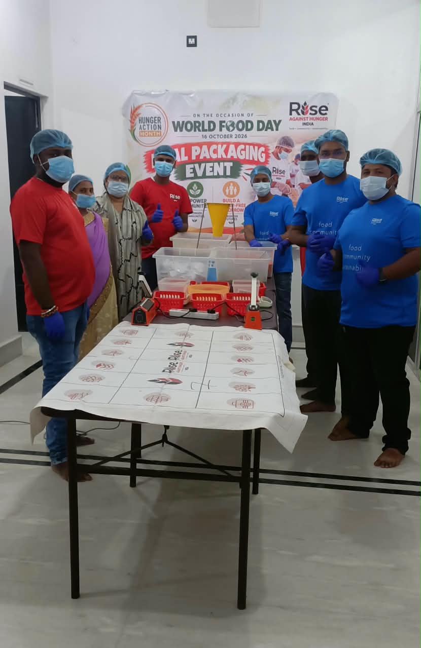 Volunteers packaging meals at the World Food Day event